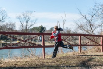 A boy tries to throw a stone across the Rappahannock.