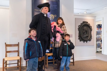 George Washington (Greg Fisher) greets a visiting family.