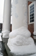 Snow pile on a portico column.