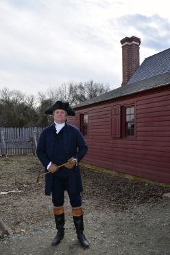 George Washington (Greg Fisher) in front of the Washington house replica.